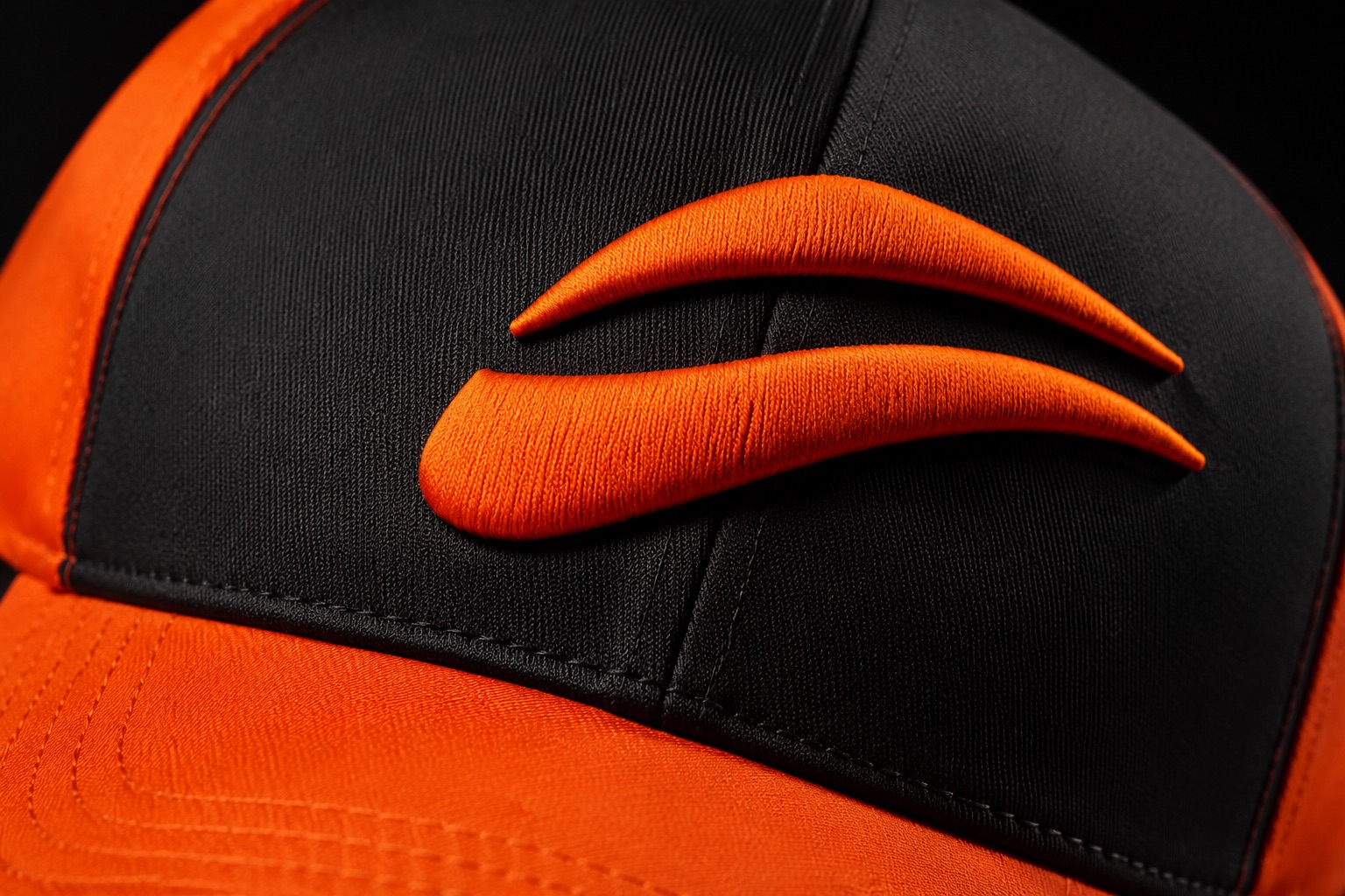Close detail of 3D puff embroidery on the front panel of a cap