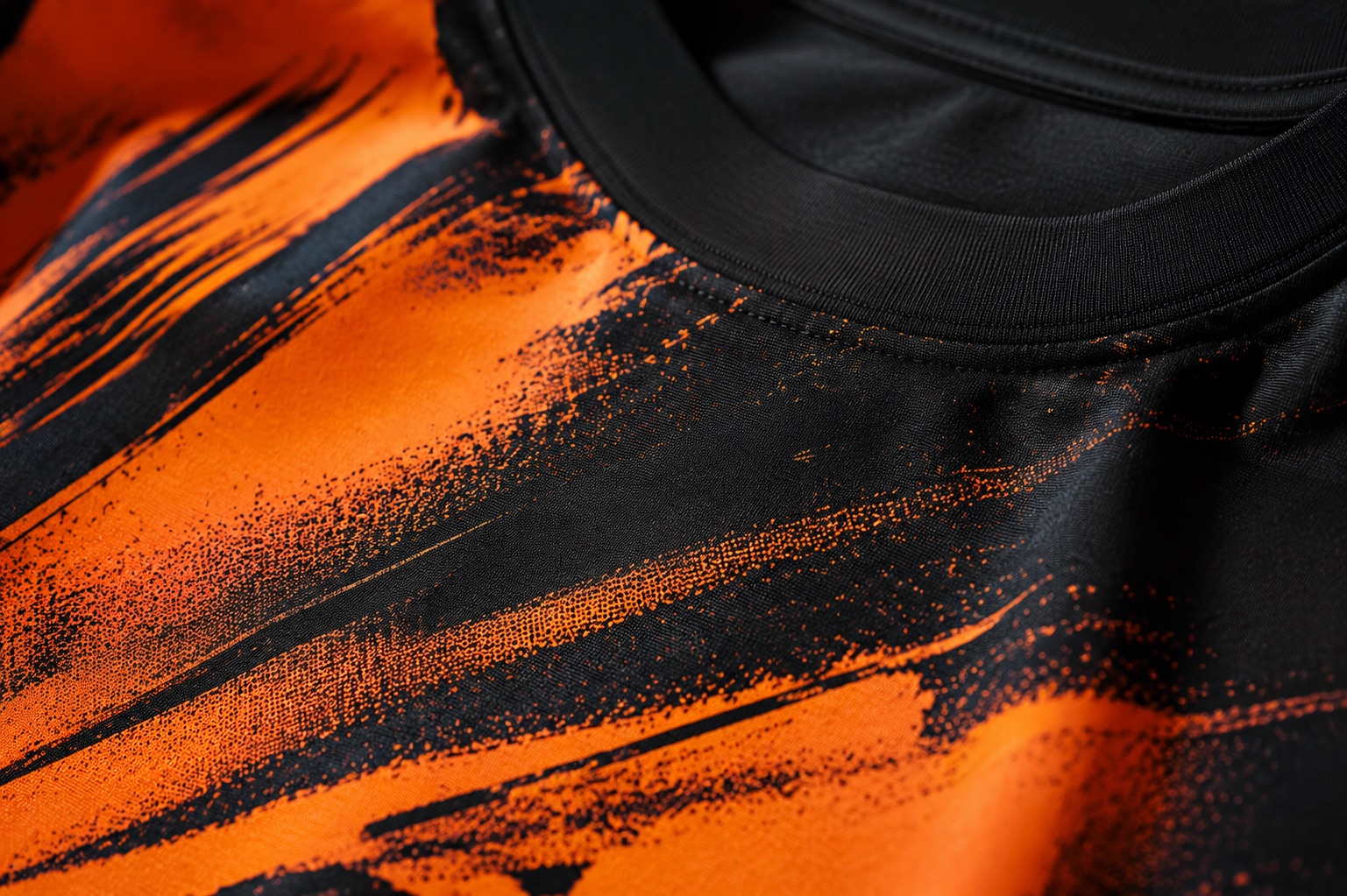 Close detail of a bright DTG print on a dark pre-treated cotton garment