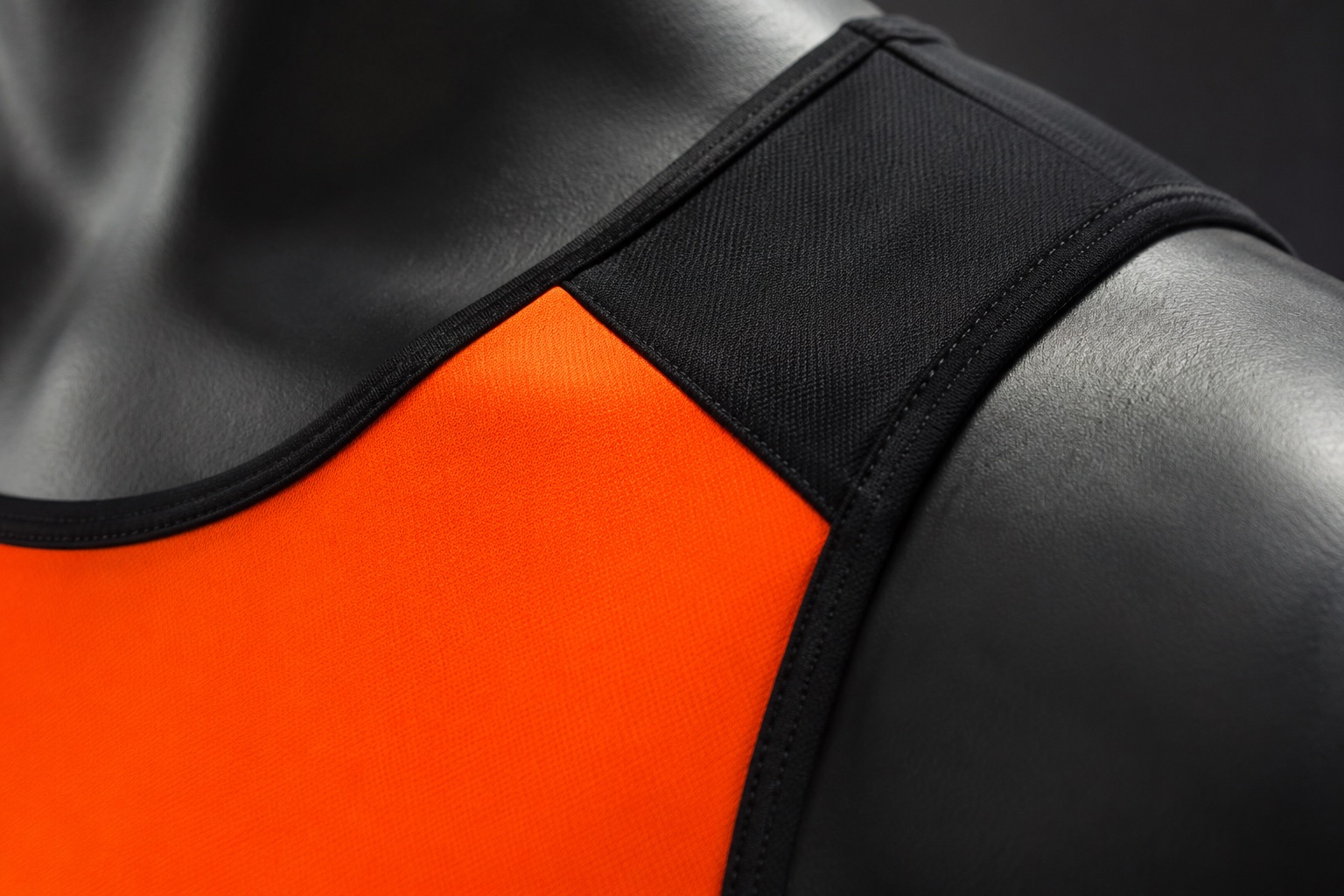 Close detail of a netball dress showing the flat-seam construction at the shoulder