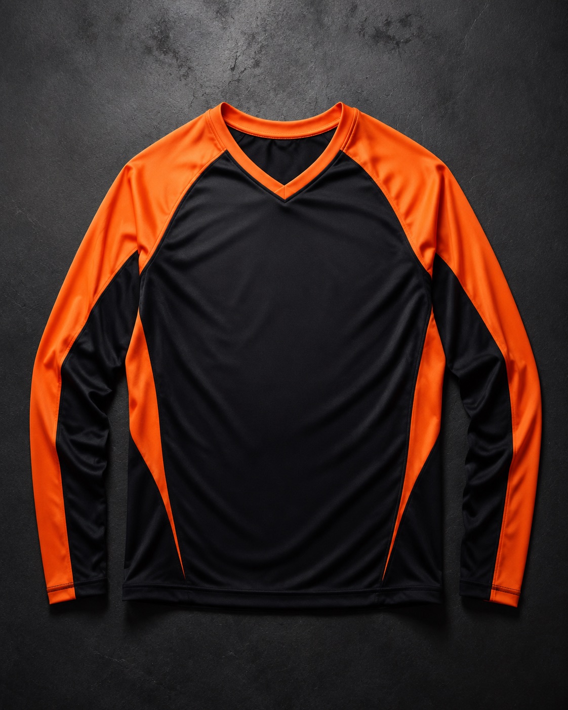 Long-sleeve volleyball jersey, flat lay on dark charcoal