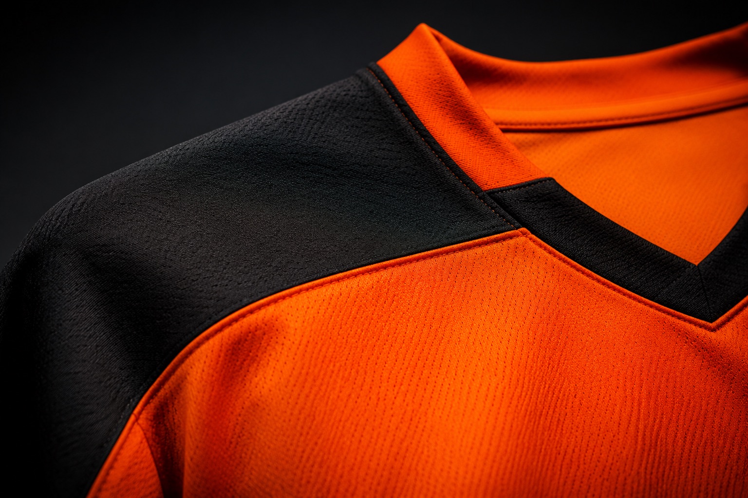 Close detail of a sublimated hockey shirt shoulder panel and collar