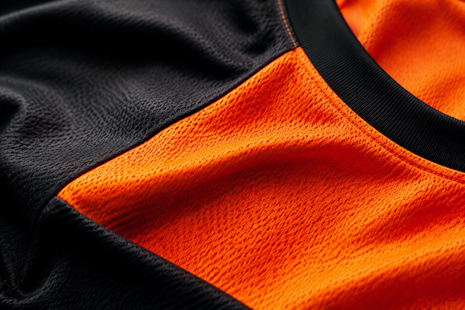Macro of a sublimated sportswear panel showing colour bonded into the fibre with no surface layer