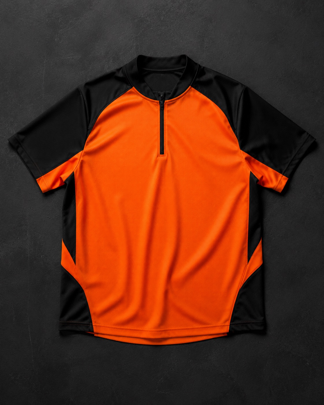 Baseball batting practice mesh top, flat lay on dark charcoal