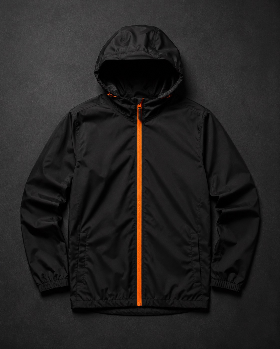 Black lightweight football rain shell jacket with orange zip detail