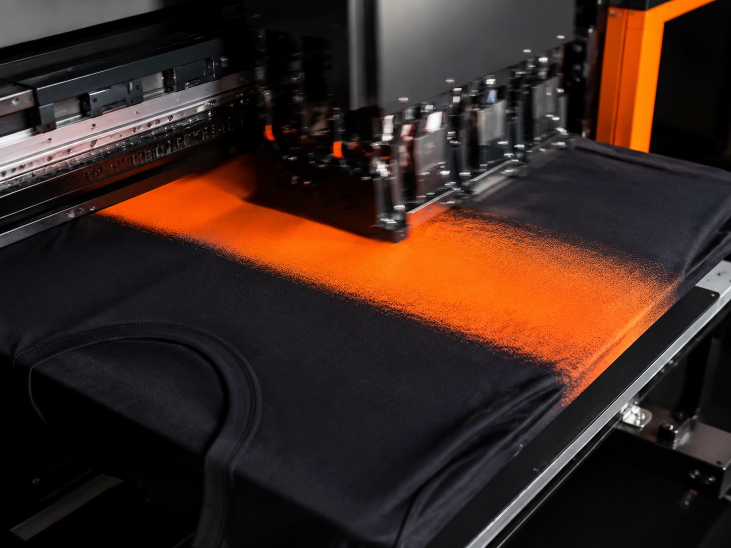 Direct-to-garment printer laying ink onto a shirt on the platen