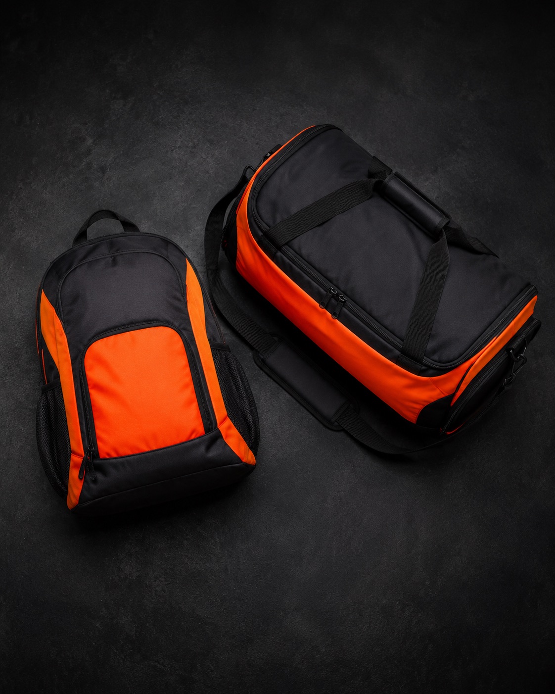 Netball squad backpack beside a coach kit bag, flat lay