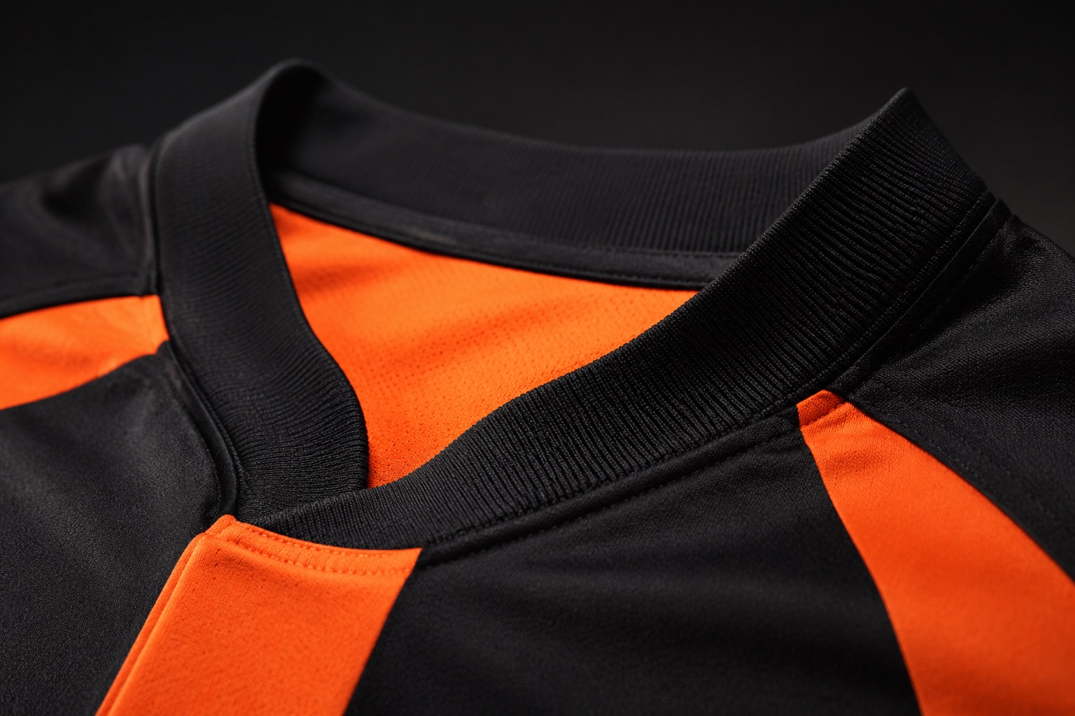 Close detail of a soft rib collar on a rugby jersey with no zip or rigid fastening