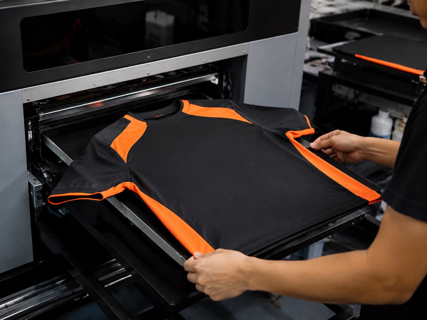 Shirt being loaded and aligned onto a direct-to-garment printer platen