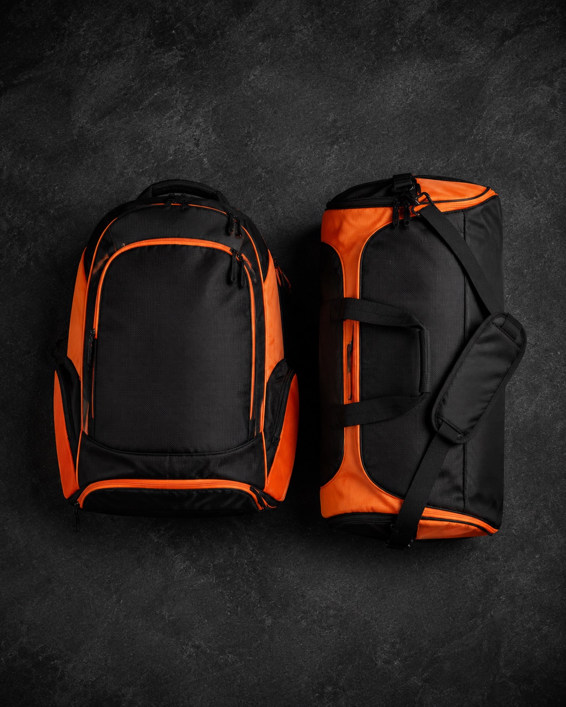 Rugby kit backpack beside a holdall, flat lay