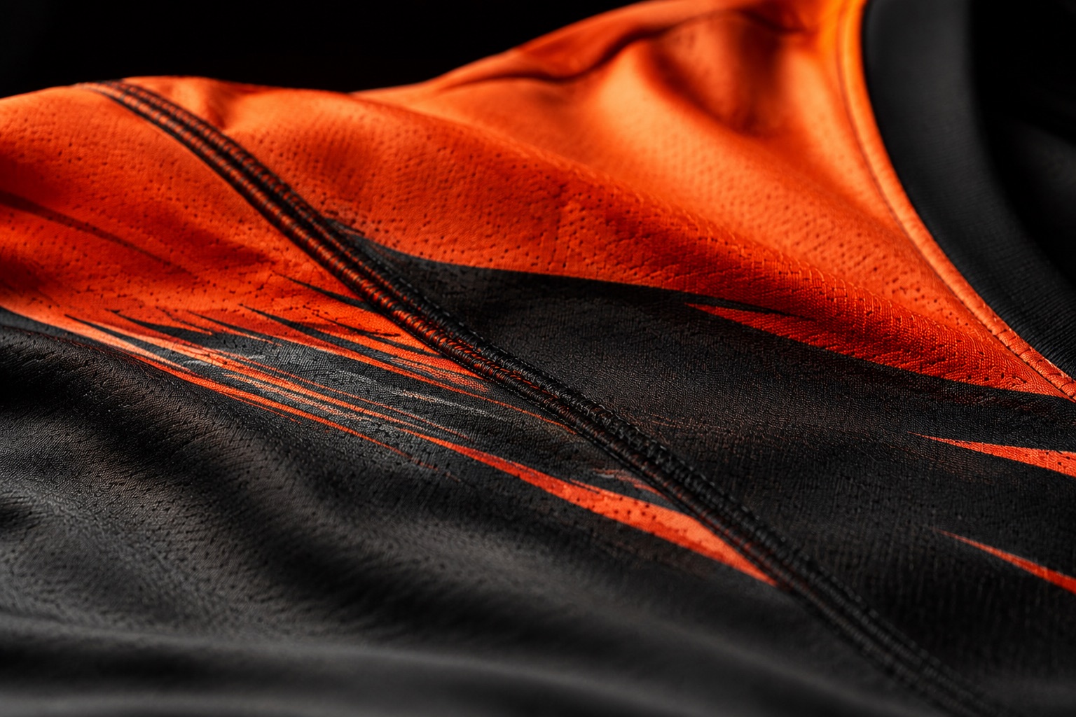 Close detail of a sublimated design running continuously across a garment seam