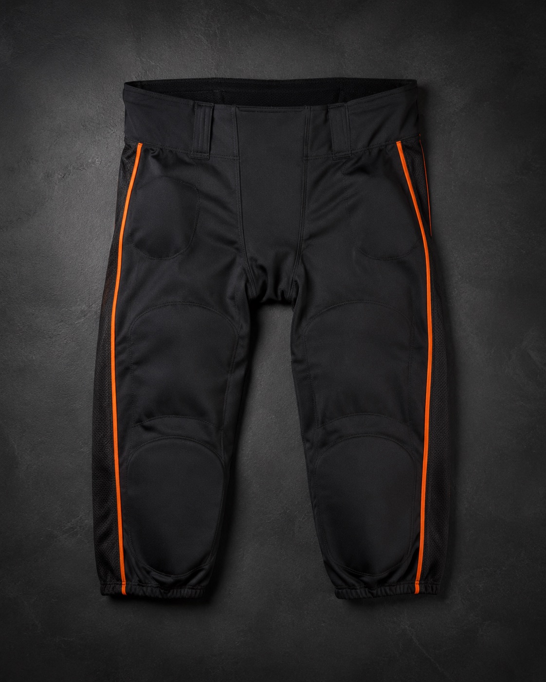 Traditional slotted American football pants with side piping, flat lay