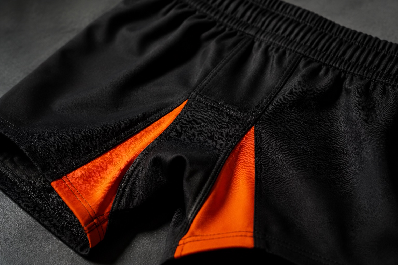 Close detail of heavy woven rugby shorts showing a reinforced gusset and waistband