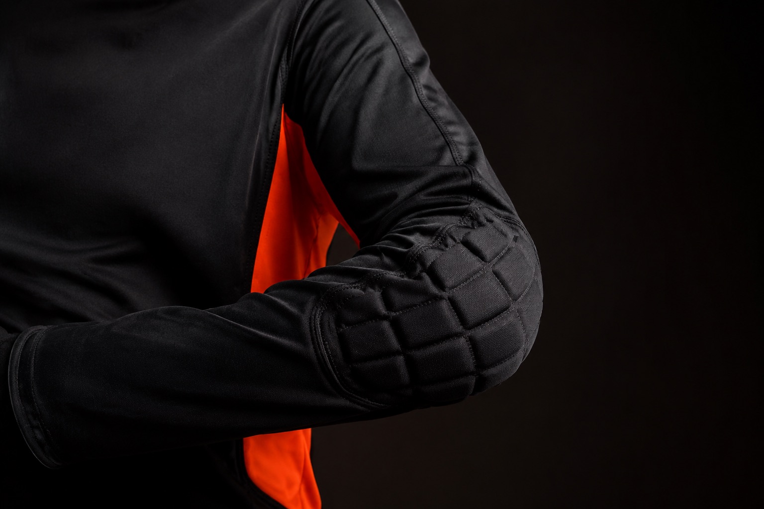 Goalkeeper jersey sleeve showing padded elbow panel construction