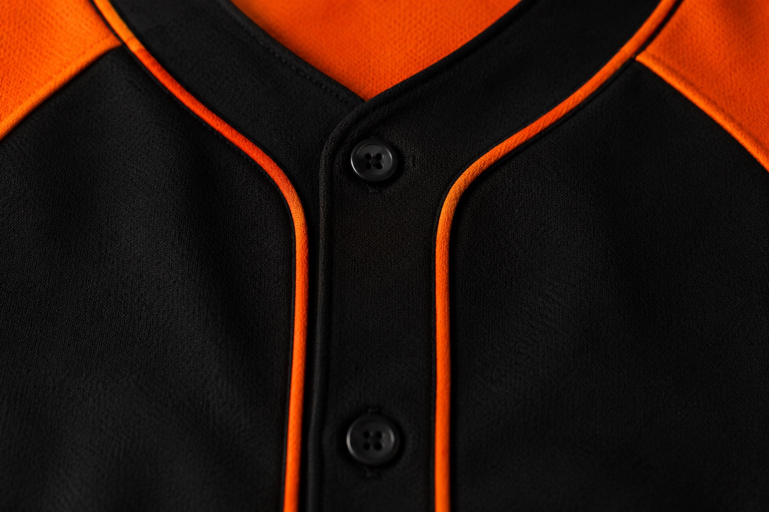 Close detail of a full-button baseball jersey placket and buttons