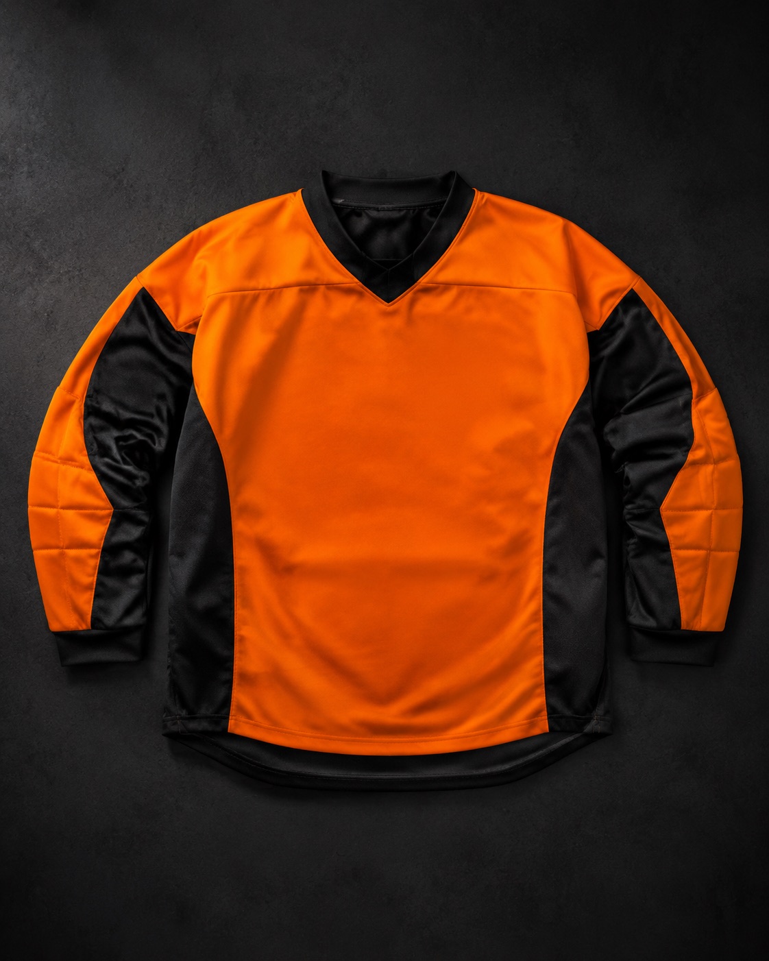 Oversized field hockey goalkeeper smock cut over body armour, flat lay